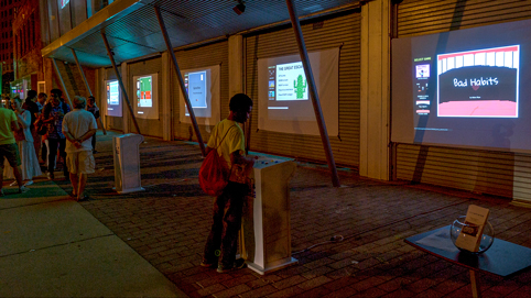 Visitors play videogames at the Street Arcade. Photo courtesy Robert Banke.