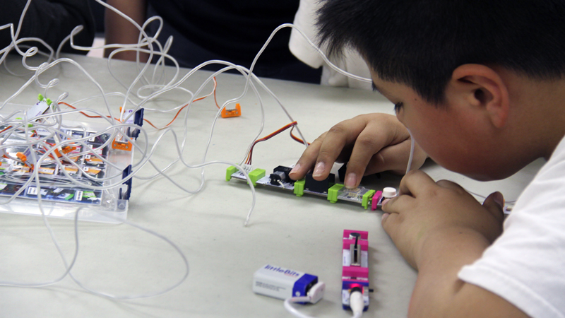A explores inputs and outputs with littleBits.