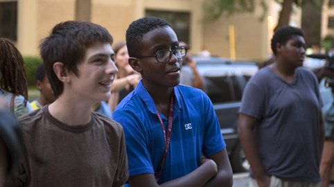 Teens check out the games at the Street Arcade, 2015.